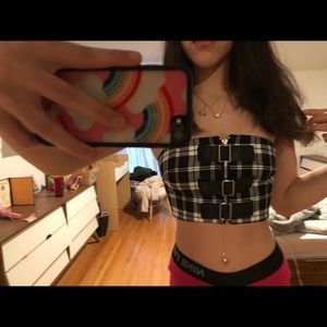 very cropped top. Zip up top with buckles